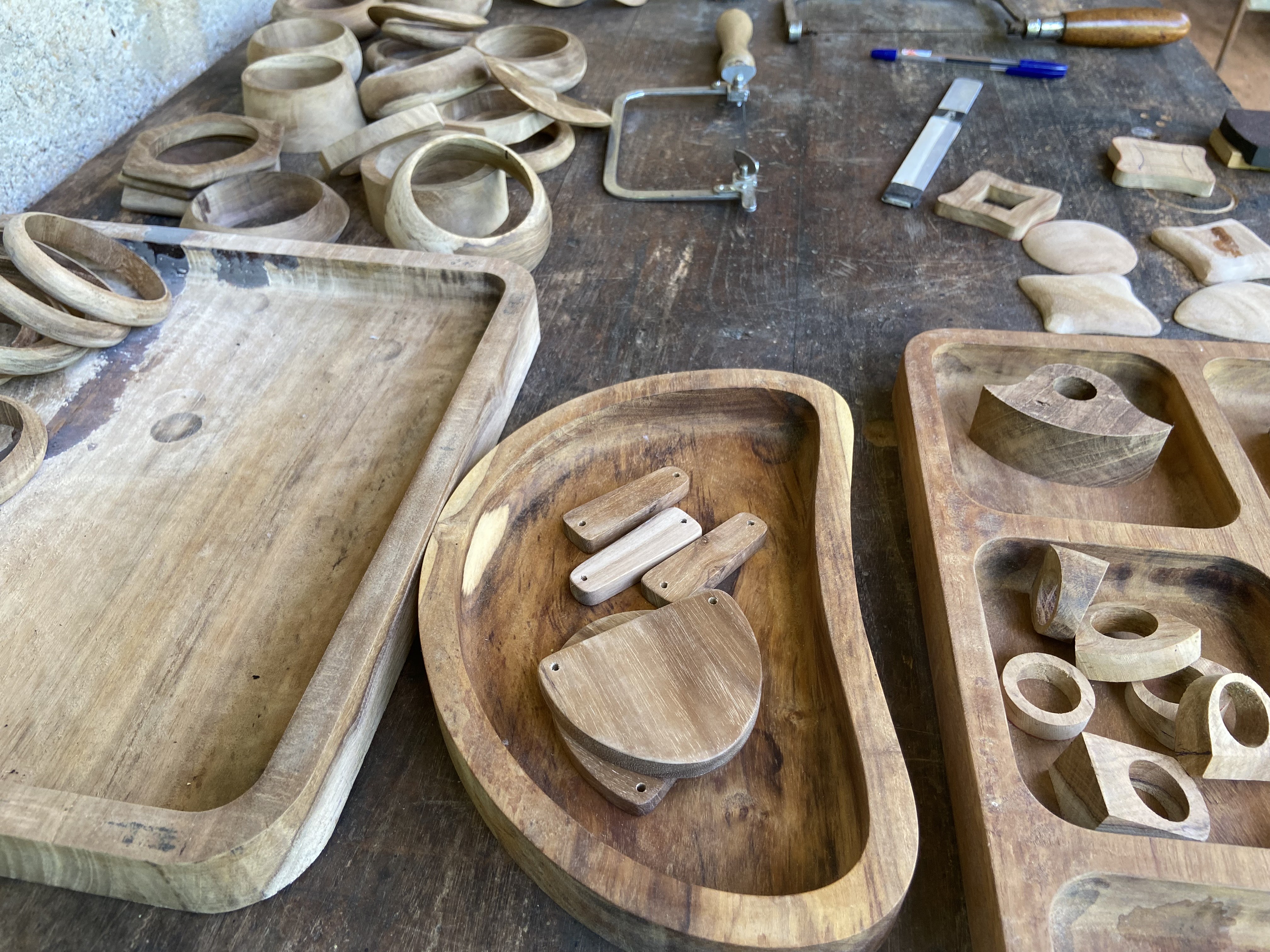 Wooden rings and bangles mid-process on the workbench